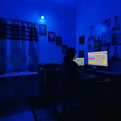 Switching up the mood with cool blue lighting for a different vibe. The atmosphere in the studio directly influences the sound of the electronic music I create.