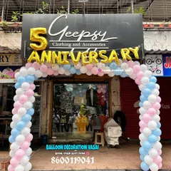 For the 5th anniversary of a clothing store, I set up this welcoming balloon arch right at the entrance. The design uses soft pink, blue, and white balloons with large gold foil letters to attract customers and celebrate the occasion.