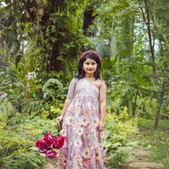 Taking the fun outdoors. This portrait, taken in a beautiful Bangalore park, shows how we use natural light and scenery to create magical, storybook-like kids' photos.