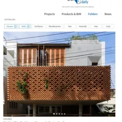 The main facade of the residence, featuring a parametrically designed brick screen. This element acts as a second skin, providing shade and privacy while allowing for natural ventilation and a dynamic play of light.