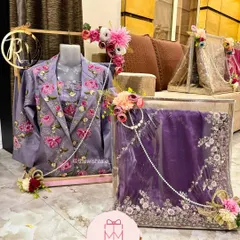 Your beautiful wedding outfits deserve to be packed just as beautifully. Here, I've arranged a stunning lavender embroidered suit and a matching floral saree, using delicate pearl strings and flowers to make the presentation perfect for the bride's trousseau.