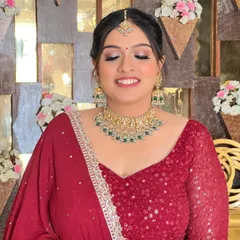 A close-up of the minimal makeup and classic bun. This bride is all smiles, looking radiant and confident.