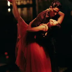The dramatic dip, a peak moment in the dance narrative for Origin & Ode. The flow and form of the red tulle dress were essential to capturing this dynamic movement.