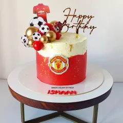 A goal-worthy cake for a Manchester United fan! This design features the team's iconic red and logo, topped with footballs and a jersey for the ultimate football-themed birthday.