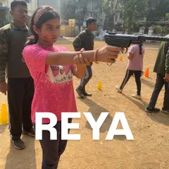 Reya showing great form and concentration during her turn at the pistol shooting range.