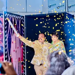 A moment of pure joy. I combined a confetti blast with sparklers for this special reveal, showering the couple in golden petals and light as they made their entrance.
