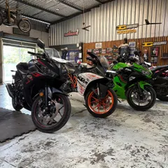 Which track day toy would you pick? A Yamaha R3, a KTM RC, and a Kawasaki Ninja lined up and ready to hit the circuit.