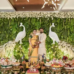 A candid moment from a beautiful Seemantham ceremony I decorated. The setup included a backdrop of fresh greenery and white peacocks, symbolizing grace and new beginnings for the happy couple.