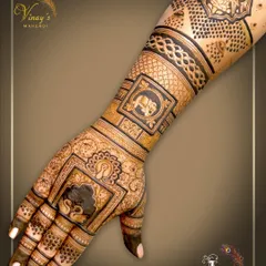 This back-hand design features framed motifs of a lotus and an elephant, connected by bands of traditional patterns.