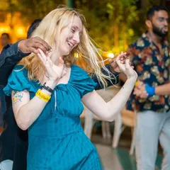 Pure joy captured mid-dance. This is the kind of authentic, happy vibe you'll find every Sunday at our Latin socials.