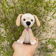 This sweet little crochet dog is a perfect gift for any dog lover. I made this one with soft beige and white yarn and gave it a cute little collar with a charm.