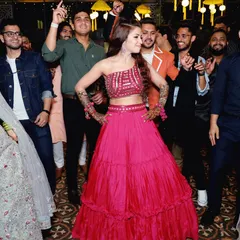 The bride-to-be owning the dance floor at her Sangeet. I capture these moments of pure joy and confidence, surrounded by friends and family.