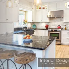 This farmhouse-style kitchen features white cabinetry, a granite countertop, and a large apron sink. The design combines traditional charm with modern functionality, including a breakfast bar for casual meals.