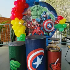 The main Avengers backdrop featuring the Hulk, Thor, Iron Man, and Captain America, with plinths themed after each hero.