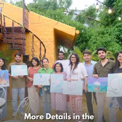 A group of happy participants from our 'Paint Your Pet' workshop holding up their masterpieces. It's a joyful afternoon of art and connection.