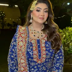 A stunning look for a Sufi Night. The makeup is glamorous with a focus on the eyes, and the side-swept hair is adorned with a traditional passa for a regal touch.