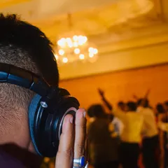 Listening closely to the mix with the dance floor buzzing in the background. This is my favorite place to be, right in the heart of the music.
