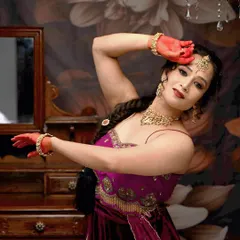 This full-length pose showcases the entire outfit and the graceful, dance-ready look. The makeup is designed to be long-lasting and picture-perfect.