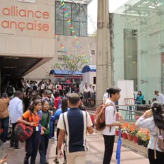 The entrance to our campus buzzing with energy during the annual Francophonie Mela. Students, families, and visitors gather, showing the scale and excitement of our cultural celebrations. It's a perfect example of the community spirit we foster.