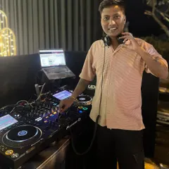 A candid moment behind the decks. Holding my headphones, listening for the perfect moment to transition to the next track.