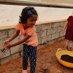 A young visitor gets her hands in the soil during a youth training program. We believe direct interaction with nature is the best way to teach children about healthy eating and sustainable agricultural practices.