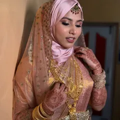 Another angle of this stunning Nikkah bridal look. The makeup is elegant and timeless, perfectly complementing her beautiful attire.