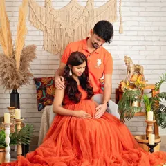 A tender moment captured between the couple, surrounded by the warm and earthy elements of the boho set.