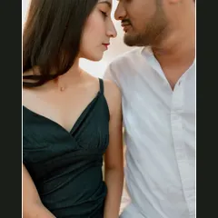 An intimate close-up portrait of a couple by the lake. This frame focuses purely on their connection, capturing the quiet and tender emotions shared between them.