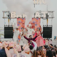 An epic shot with the entire wedding party on the baraat truck, surrounded by smoke and cheers. I am right there in the middle, fueling the excitement.