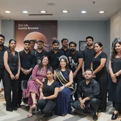 The whole team together with our wonderful client. This photo captures the friendly and supportive atmosphere of my salon. We work as a family to make every client feel special.