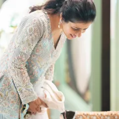 For my daughter's half birthday, I needed an outfit that was beautiful but also practical for holding her. I worked with a designer to create this indo-western look that was comfortable and didn't have any sharp bits. This is the kind of thoughtful styling I bring to new moms.