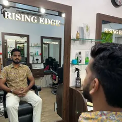 Happy vibes and happy clients. A customer enjoying the clean and relaxing atmosphere of the salon while waiting for his service.