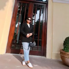 Here is the same minimal outfit with a black blazer and jeans, shot in a different light. It shows how a simple, well-put-together look can be your reliable choice for looking cool and confident.