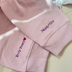 For those secret messages and inside jokes. This matching couple's hoodie set has custom text embroidered on the cuffs. It's a subtle, sweet way to feel connected.