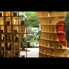 A detail of the 'Stradata' installation, showing the intricate waffle structure and the interplay of light and shadow within its cells. The project was designed to be self-supporting and was assembled without glue for sustainability.