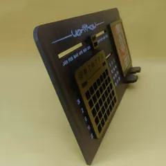 A side view of the infinity calendar, showing its sleek wooden finish and the depth of the design. It's a durable and practical desk accessory.