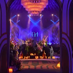 The grand entrance to our 'Shaam Sufiana'. We transformed a space with layers of blue, dramatic lighting, and countless candles to create a soul-stirring atmosphere for an evening of Sufi music.