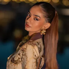 A close-up of the look I created for Anushka Sen at the Cannes Film Festival. The concept was inspired by an iced cortado for a Nespresso event, blending earthy tones with intricate details like these statement floral earrings and a sleek ponytail for a chic, international red carpet appearance.