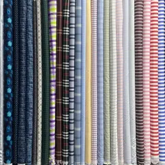 An overview of my shirting fabrics, showcasing the variety of checks, stripes, and prints available for your next custom shirt.
