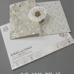 This simple and elegant card features a Ganesha emblem on a pop-out floral medallion. The design is clean, with gold foil accents for a touch of grace.