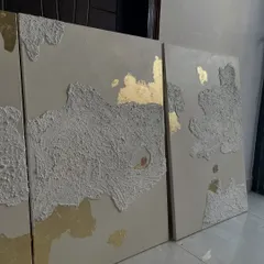 The textured and gold leaf panels from the featured set, seen here in my studio. This angle shows how the light catches the metallic and textured surfaces differently.