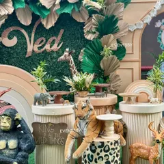 Detailed view of the dessert stands and animal figures, showing how every element is tied into the wild jungle theme.