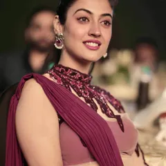 A candid shot of an actress enjoying the show. These photos add a narrative element, showing the guests' experience at the event.