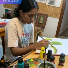 A student finds solace and focus in her acrylic painting. Our sessions are designed to be a creative escape, helping you find calm and purpose even in the midst of a busy life.