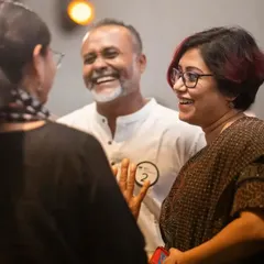 Shared laughter between guests during an interactive performance. My goal is to bring people together and create connections through a shared sense of fun.