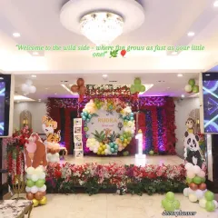 Welcome to the wild side! This grand jungle-themed setup for a first birthday party shows how I can transform a large venue into an immersive experience. With a custom backdrop, vibrant balloon arrangements, and adorable animal cutouts, I create a playful safari adventure for the little ones.