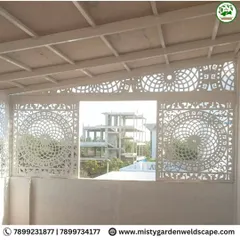 A close-up of the elegant CNC designer frames installed at a project in Hoskote. The intricate, circular pattern adds a sophisticated touch and serves as a beautiful privacy screen.