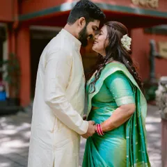 A moment of pure connection for Nidhi and Aditya. The gajra in her hair and the traditional attire create a portrait that is both intimate and culturally rich, captured during their Pune engagement.