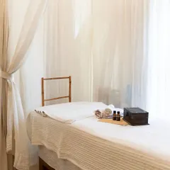 The spa bed is set with fresh linens, towels, and our signature aromatherapy oils. Every detail is arranged to ensure your experience is one of complete comfort and luxury.