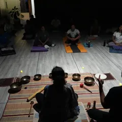 A glimpse into the serene atmosphere of our sound healing workshops. In the gentle glow of candlelight, we use Tibetan singing bowls to create a soundscape that calms the mind and balances your energy centers.